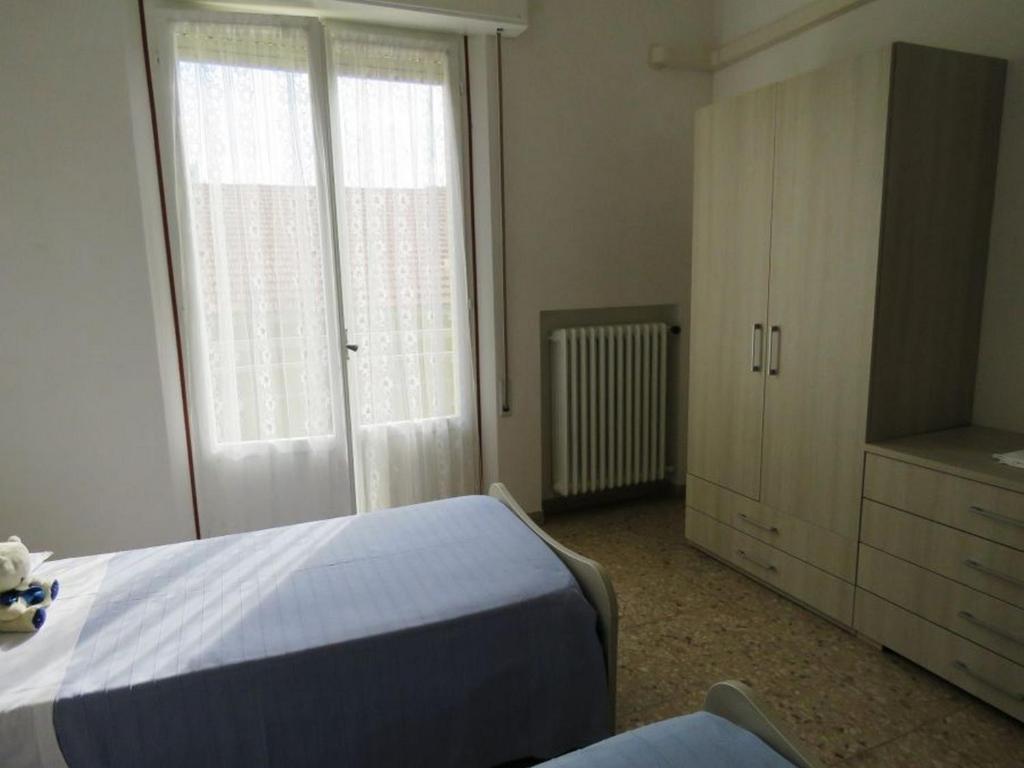 Łóżko lub łóżka w pokoju w obiekcie Appartamenti Tevere