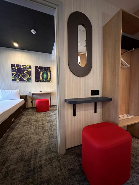 Postel nebo postele na pokoji v ubytování IQ Hotel