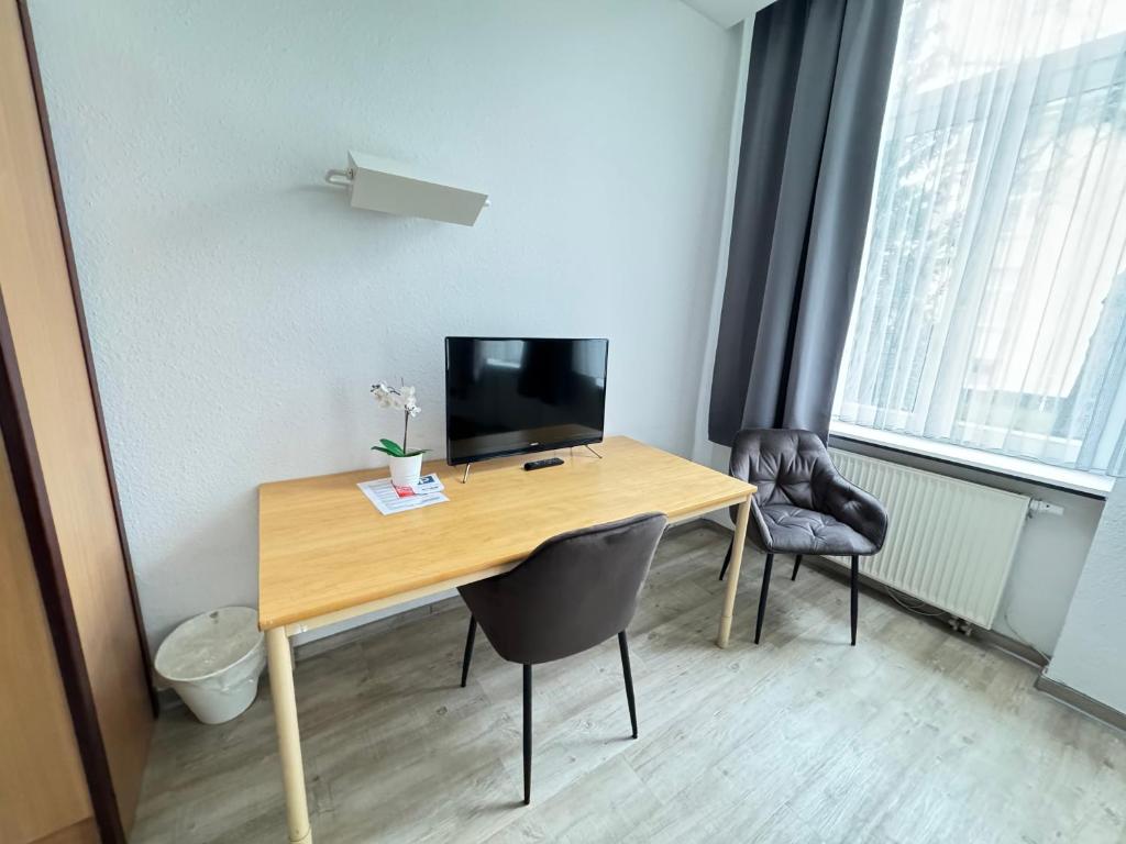 TV a/nebo společenská místnost v ubytování Appartement-Hotel Rostock