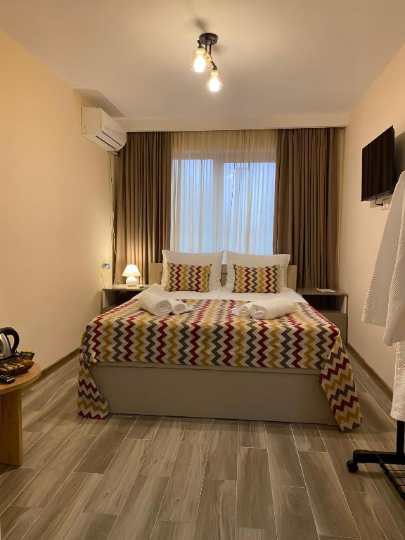 Postel nebo postele na pokoji v ubytování Kera Rooms