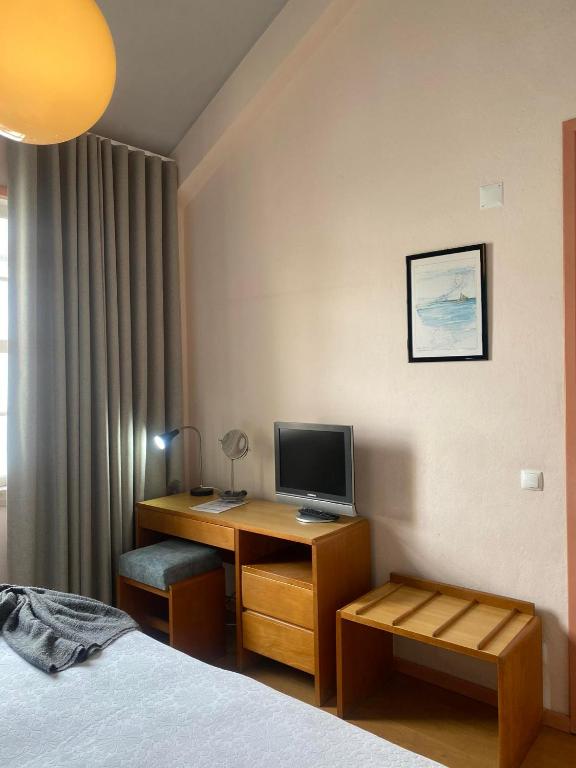 TV a/nebo společenská místnost v ubytování Hospedaria Verdemar