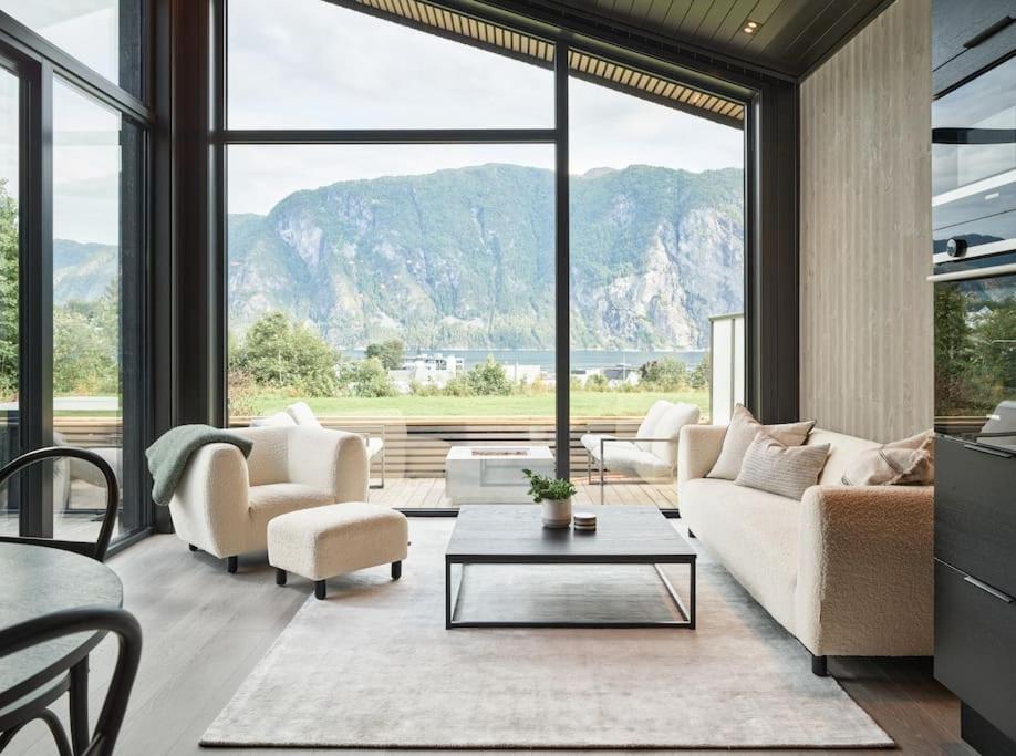 a living room with a view of mountains at Koie Deluxe II in Stranda