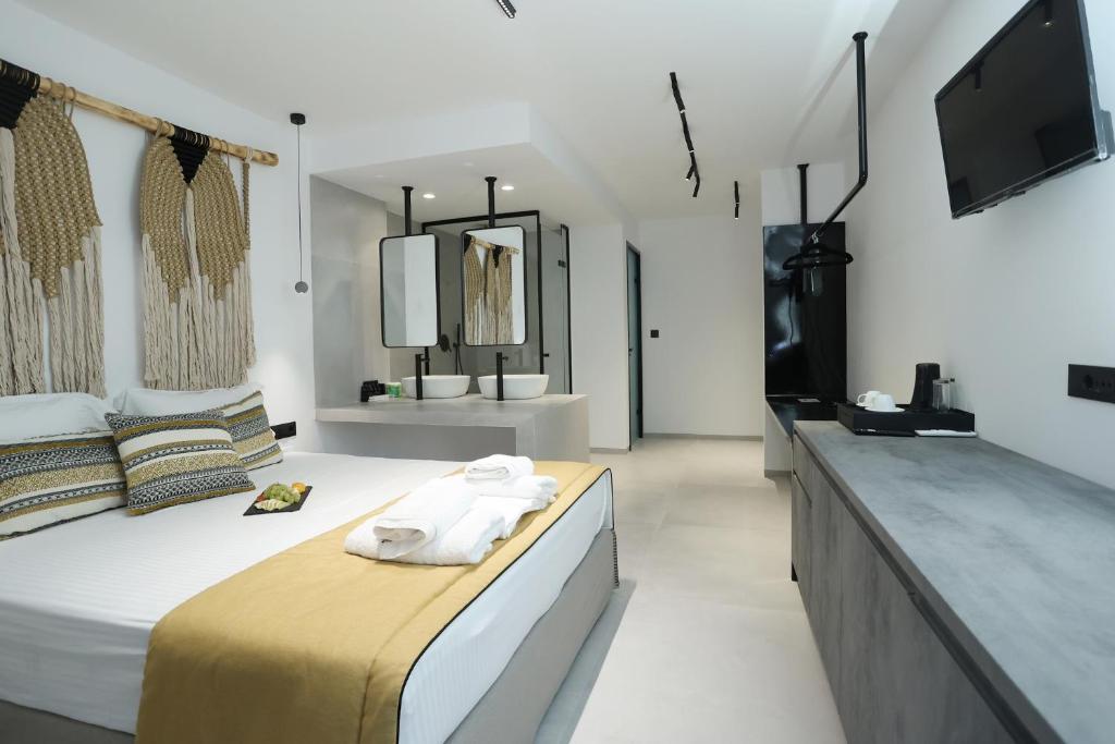 Postel nebo postele na pokoji v ubytování Yianna Hotel