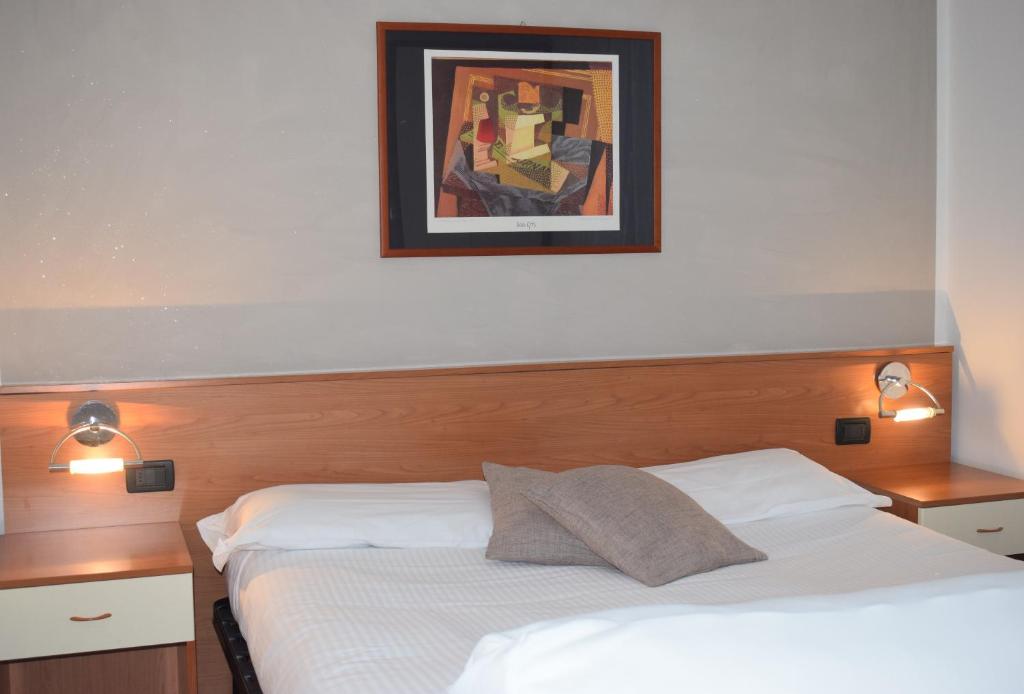 Postel nebo postele na pokoji v ubytování Albergo Canella