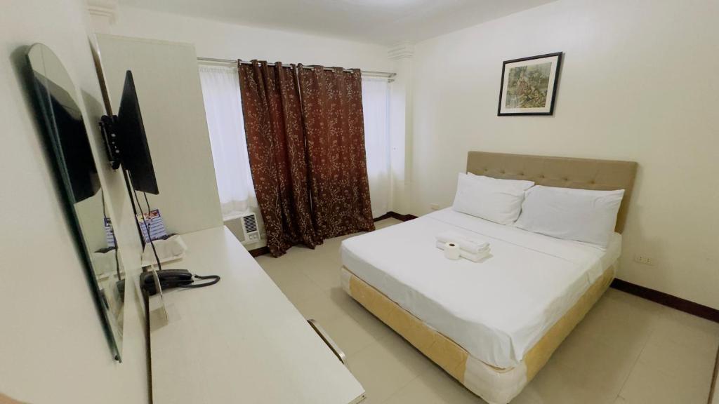 Postel nebo postele na pokoji v ubytování La Anclar Hotel