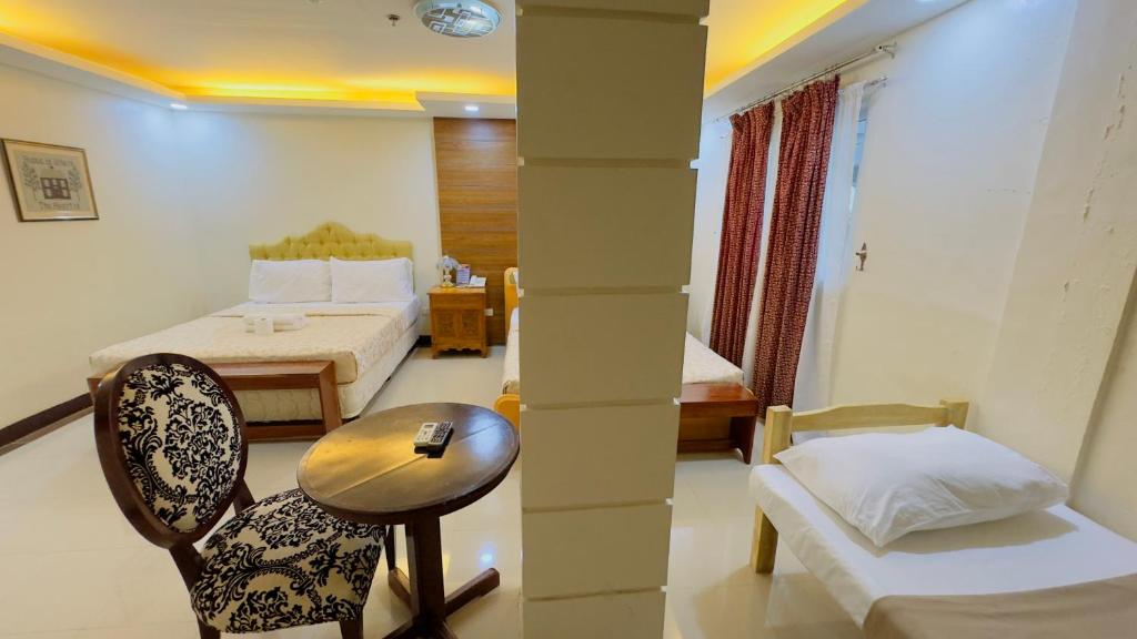 Postel nebo postele na pokoji v ubytování La Anclar Hotel