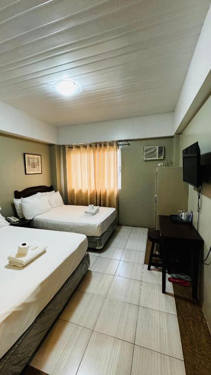 Postel nebo postele na pokoji v ubytování La Anclar Hotel