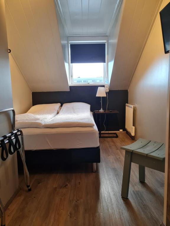 Postel nebo postele na pokoji v ubytování Lava Guesthouse