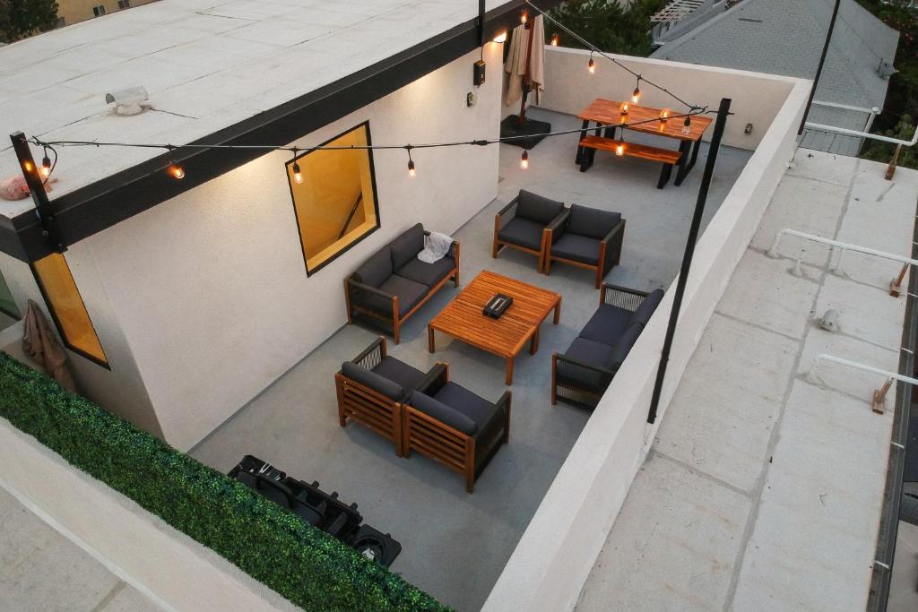 an overhead view of a patio with chairs and a table at Metro Horizon by AvantStay Rooftop Deck City View in Los Angeles