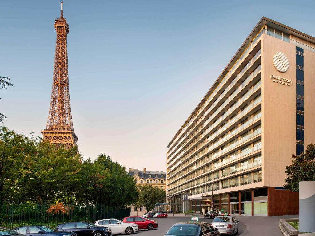 a building with the eiffel tower in the background at Pullman Paris Tour Eiffel in Paris