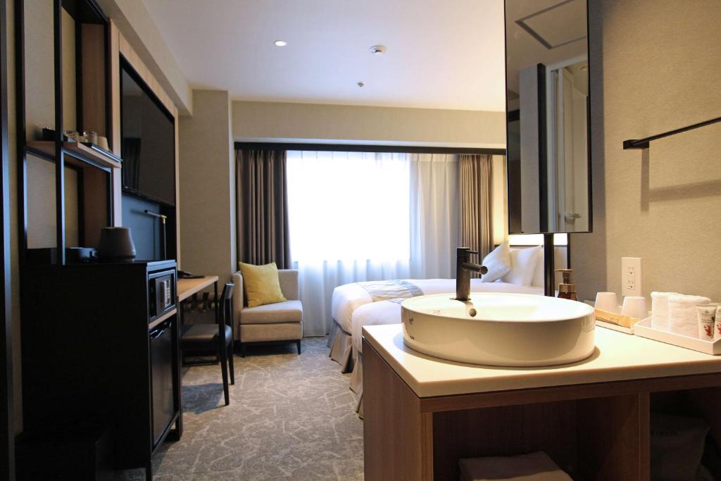 Llit o llits en una habitació de Best Western Plus Nagoya Sakae