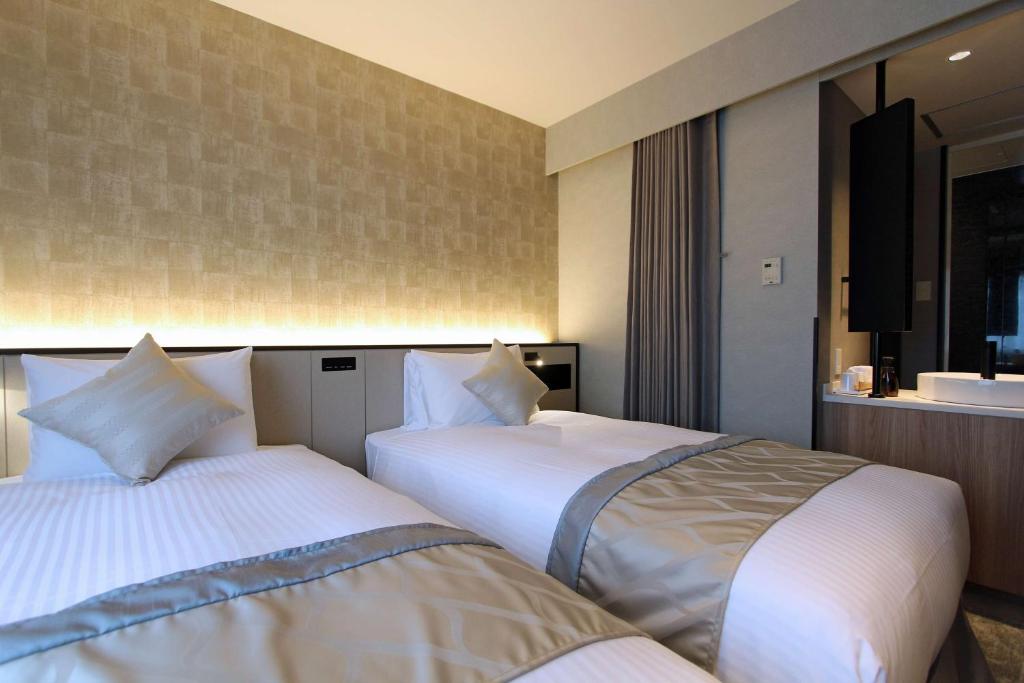 Llit o llits en una habitació de Best Western Plus Nagoya Sakae