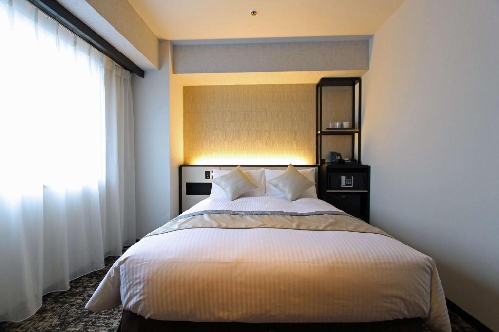Llit o llits en una habitació de Best Western Plus Nagoya Sakae