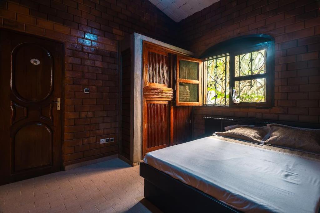 Ліжко або ліжка в номері Villa Gaudi (Gaoudi)
