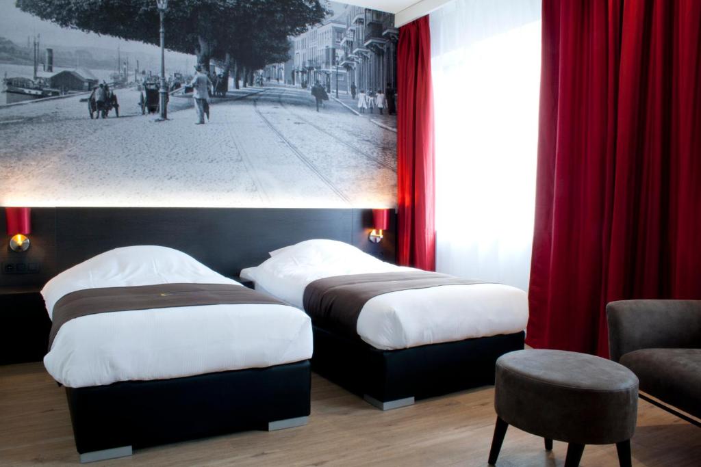 Postel nebo postele na pokoji v ubytování Bastion Hotel Arnhem