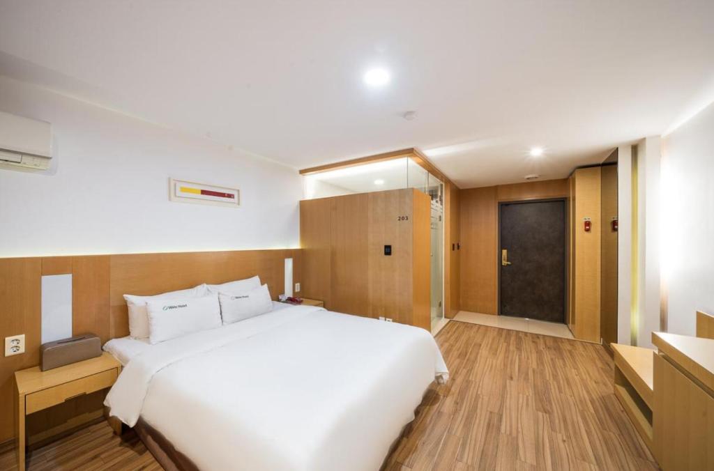 Postel nebo postele na pokoji v ubytování Wate Hotel