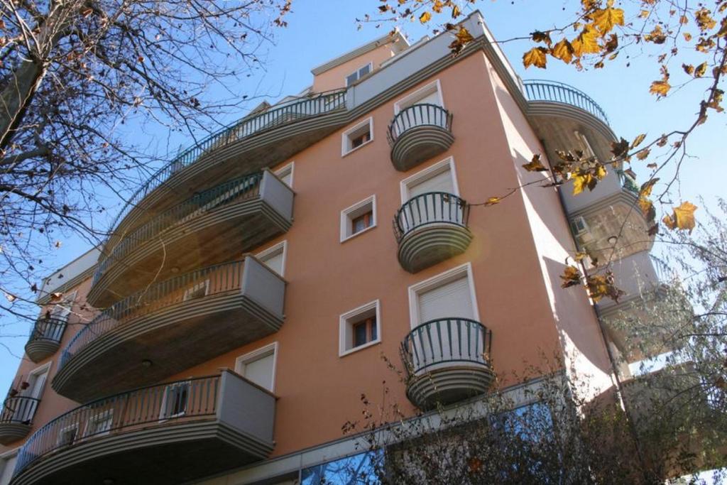 a building with balconies on the side of it at Residenza Novalba in Riccione