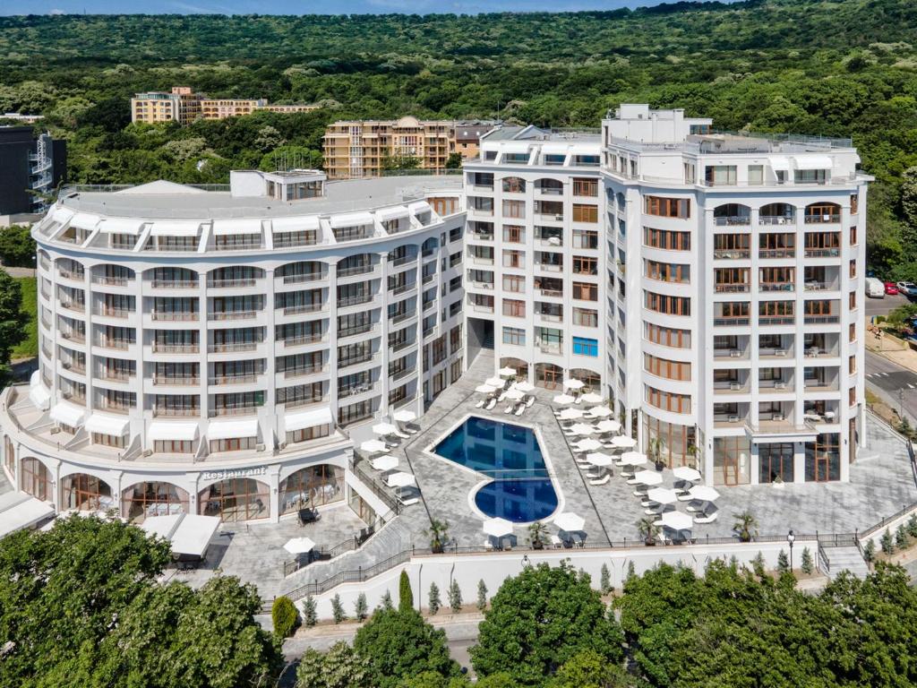 an aerial view of a large building with a pool at Continental Apartments in Golden Sands