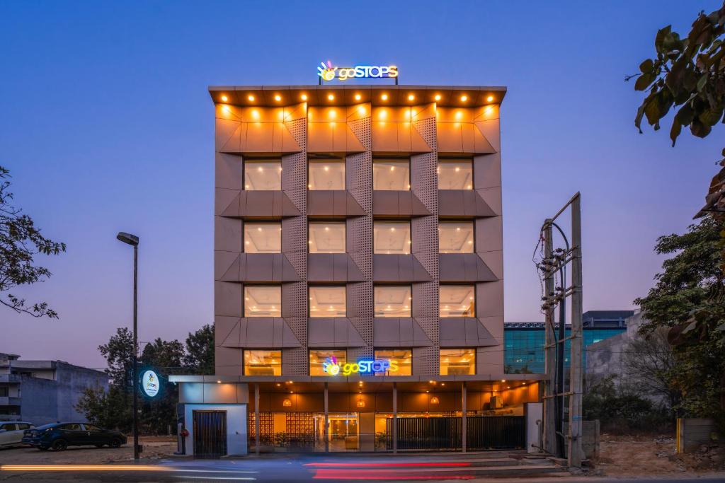 a hotel building with lights on top of it at goSTOPS Gurugram in Gurgaon