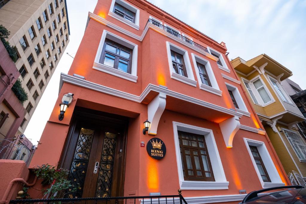 a orange building with a sign on it at King Suites Beşiktaş in Istanbul
