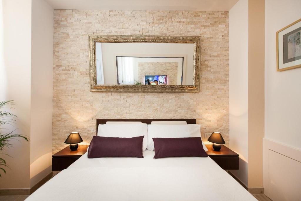 Postel nebo postele na pokoji v ubytování Apartments Villa Bianca