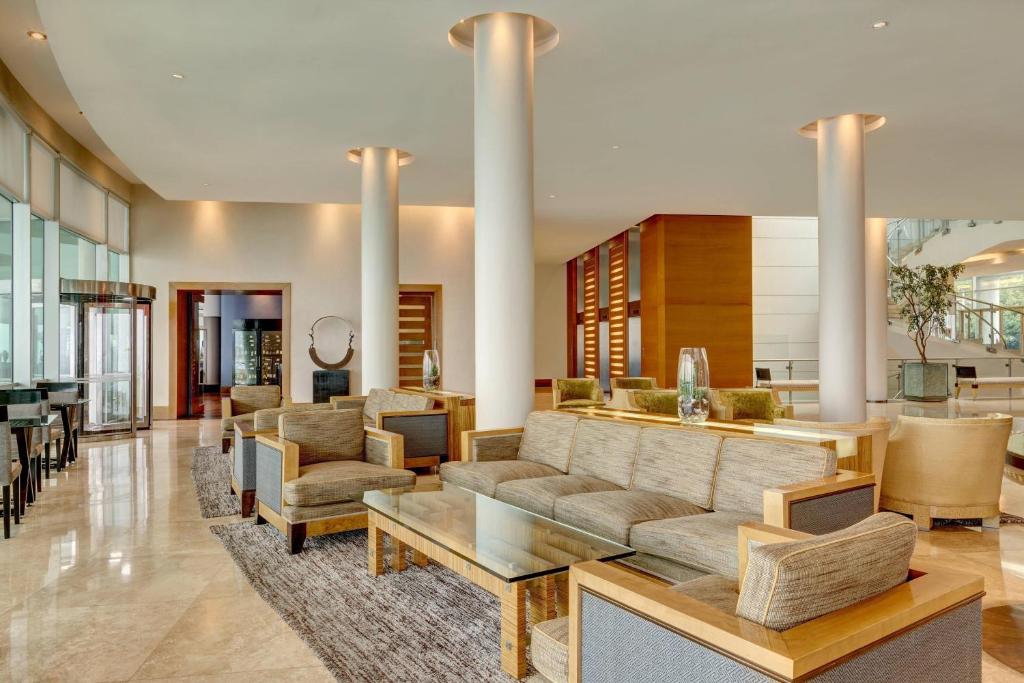 a living room with a couch and a table at Sheraton Miramar Hotel & Convention Center in Viña del Mar