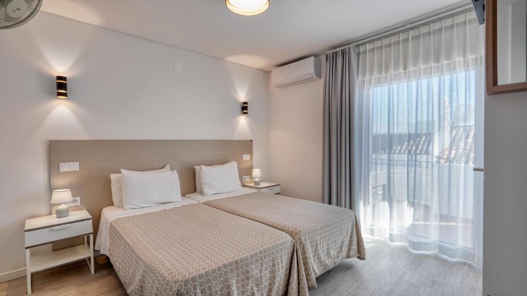 Postel nebo postele na pokoji v ubytování Guest House Dianamar