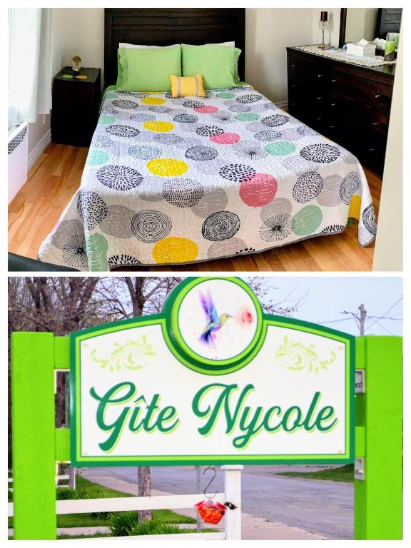 a sign for a gift waveride in front of a bed at Gîte Nycole in Perce