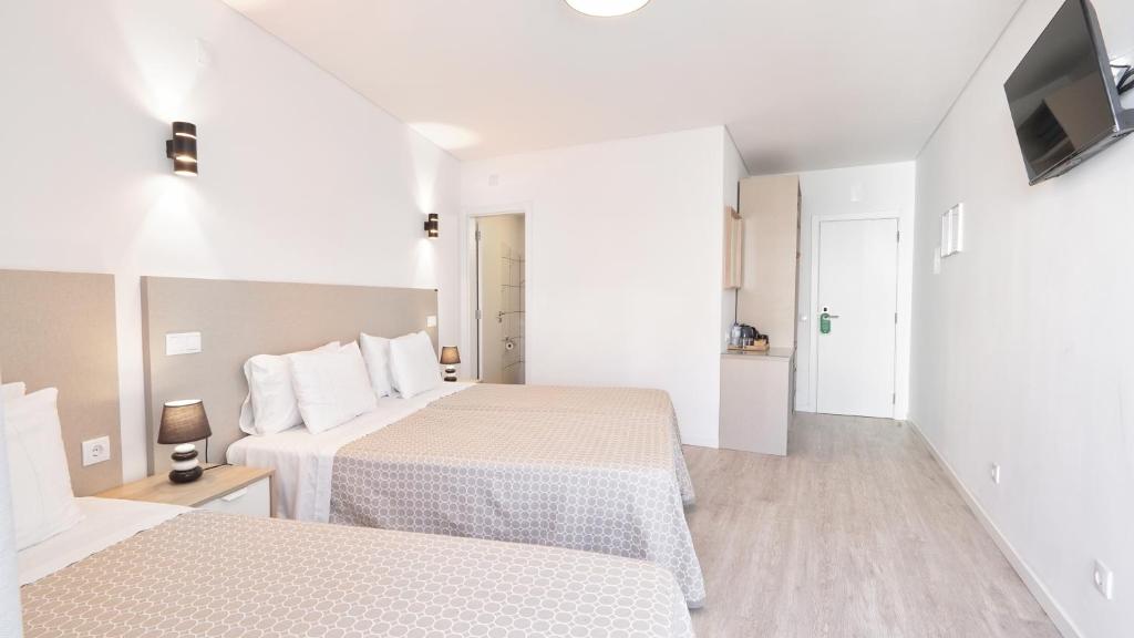 Postel nebo postele na pokoji v ubytování Guest House Dianamar