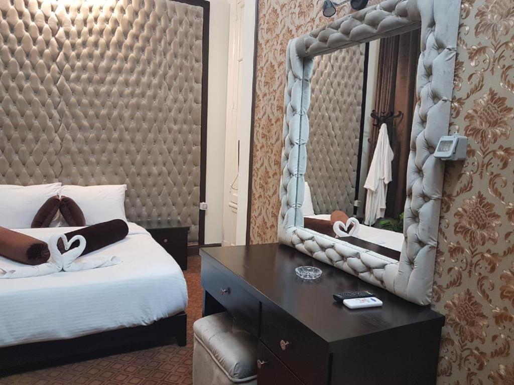 Postel nebo postele na pokoji v ubytování Cairo Paradise Hotel