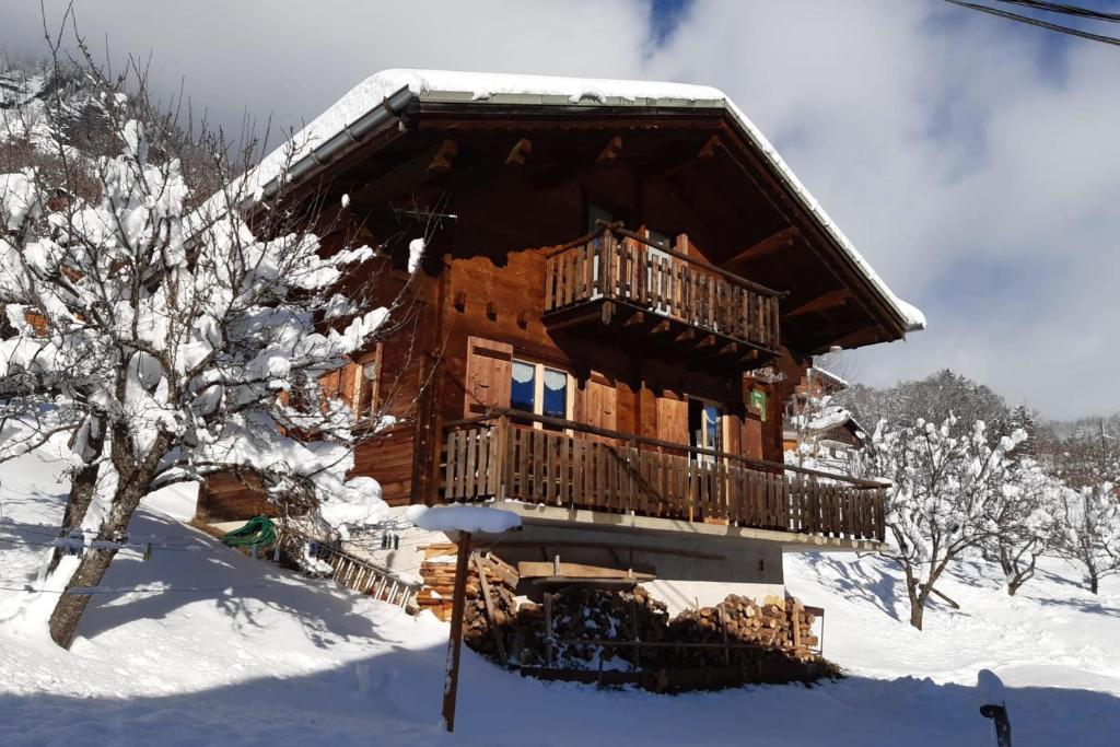 a log cabin in the snow at Savoyard nest with Mont Blanc view in Flumet