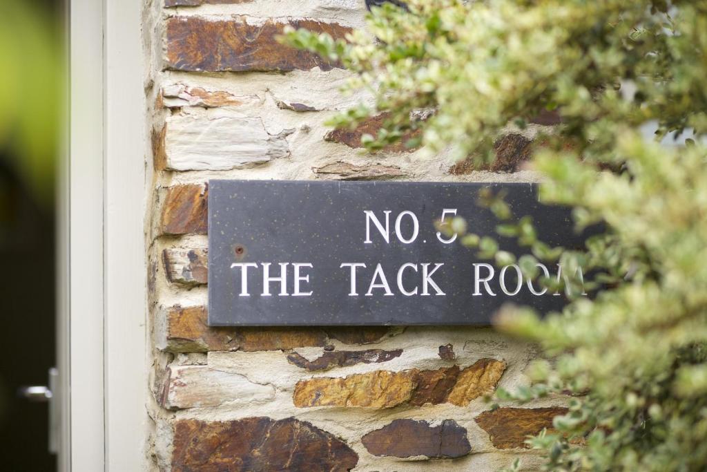a sign that says no the tack rock on a brick wall at The Plume of Feathers in Mitchell