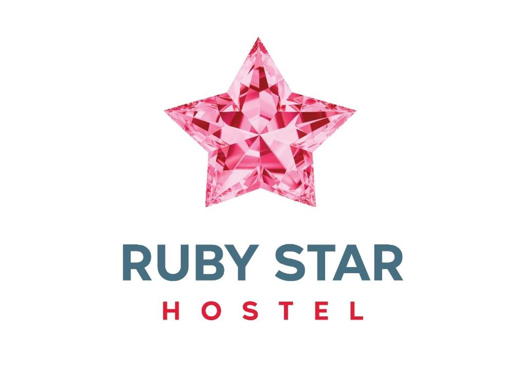 a pink star with the words ruby star hospital at Ruby Star Hostel Loft Bed 21 in Dubai