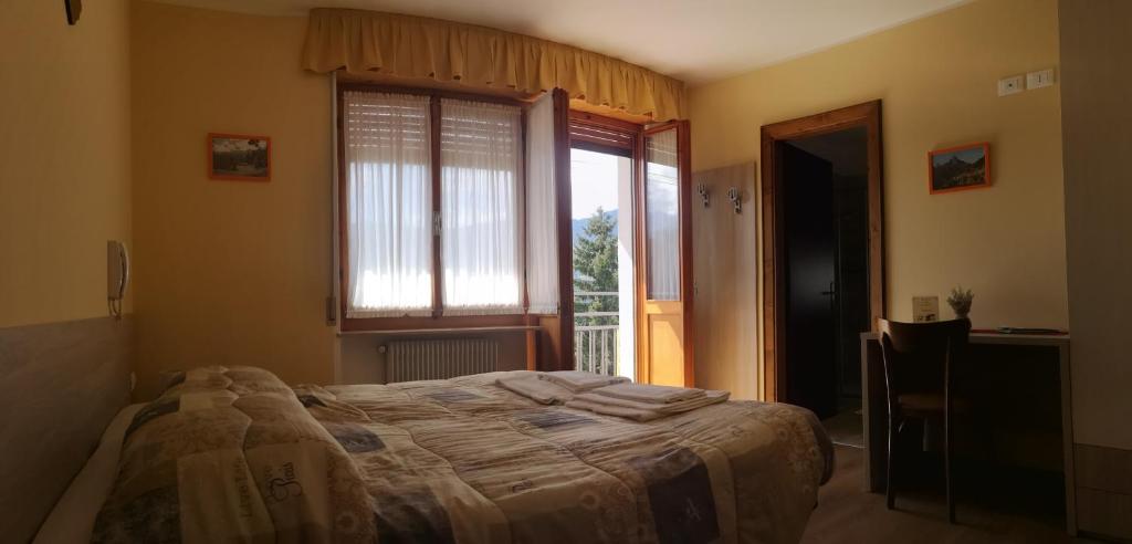Postel nebo postele na pokoji v ubytování Albergo Bar Ristorante Da Gina