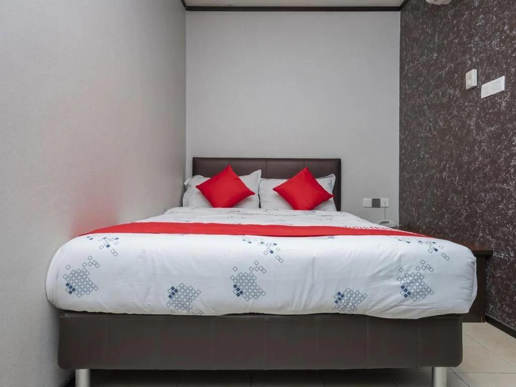 Postel nebo postele na pokoji v ubytování Suan Bee Hotel@Sutera