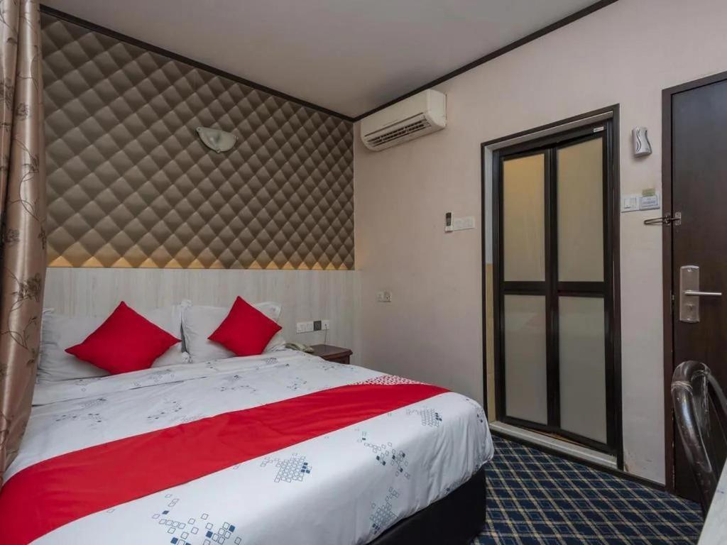 Postel nebo postele na pokoji v ubytování Suan Bee Hotel@Sutera