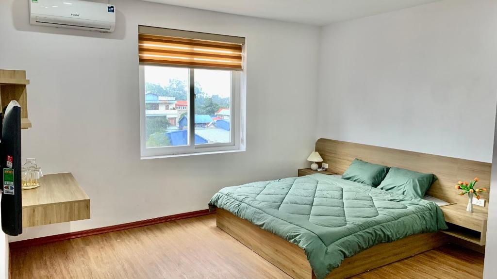 מיטה או מיטות בחדר ב-Bảo An Home