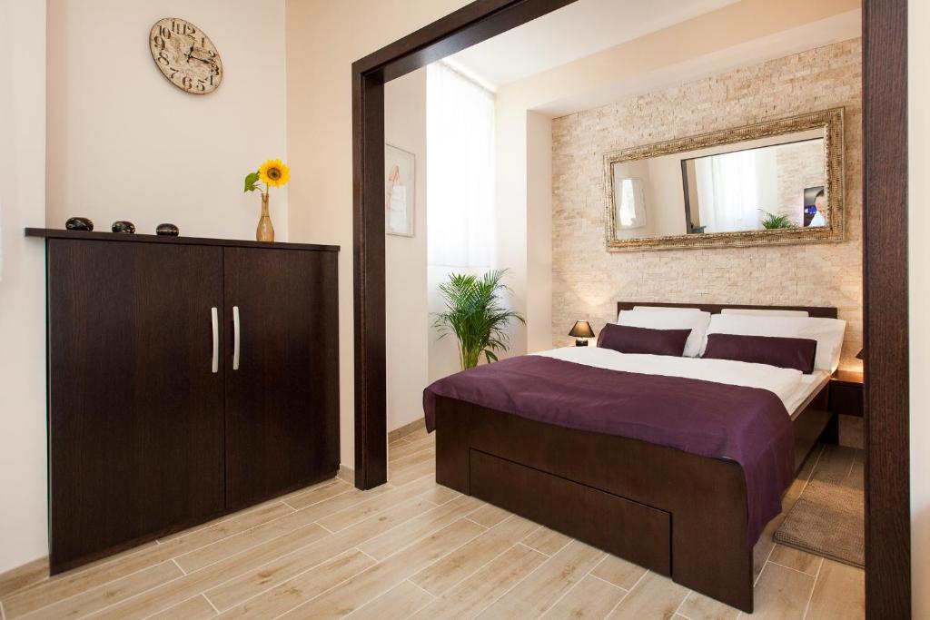 Postel nebo postele na pokoji v ubytování Apartments Villa Bianca