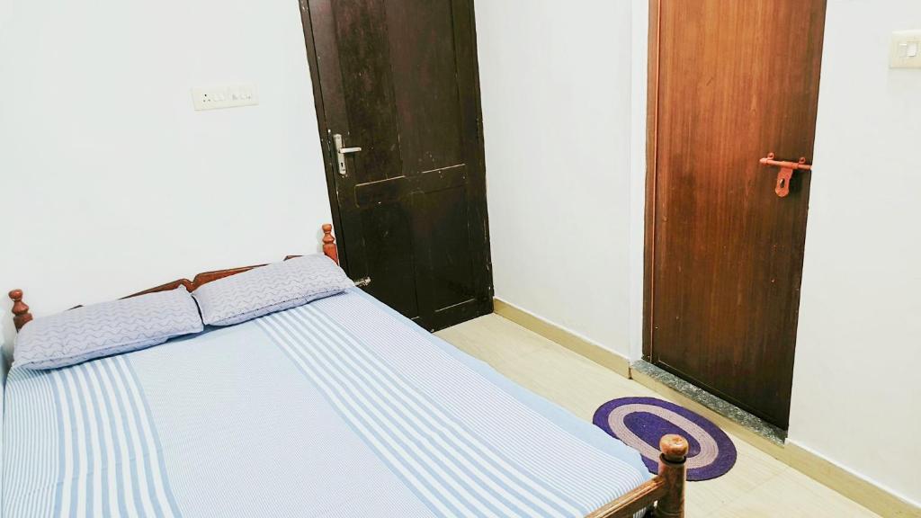 Postel nebo postele na pokoji v ubytování Juliet's Homestay