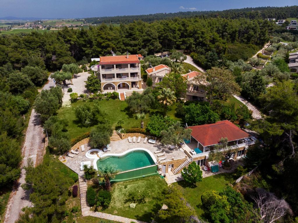 an aerial view of a house with a swimming pool at Sanidiamonds in Sani Beach
