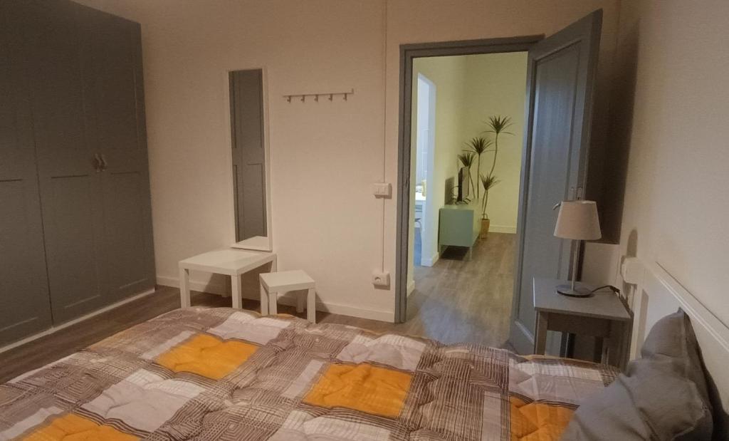 a bedroom with a bed and a hallway with a mirror at Corso Italia in San Giovanni Valdarno
