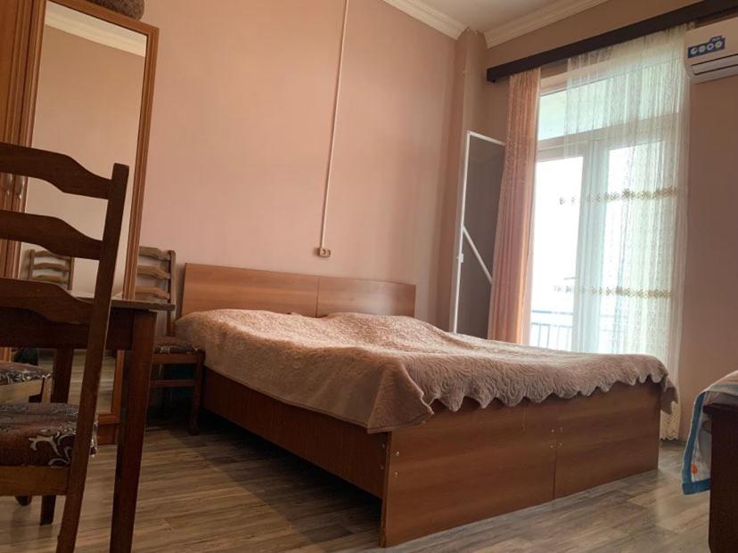 Postel nebo postele na pokoji v ubytování Guesthouse Tornike