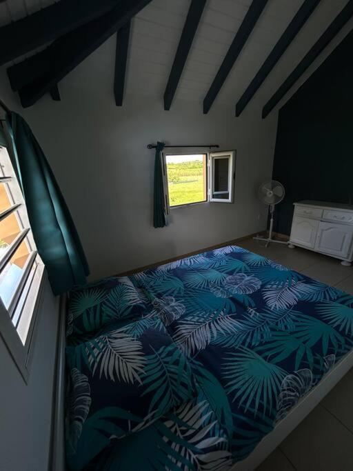 Postel nebo postele na pokoji v ubytování Logement Ghenoah