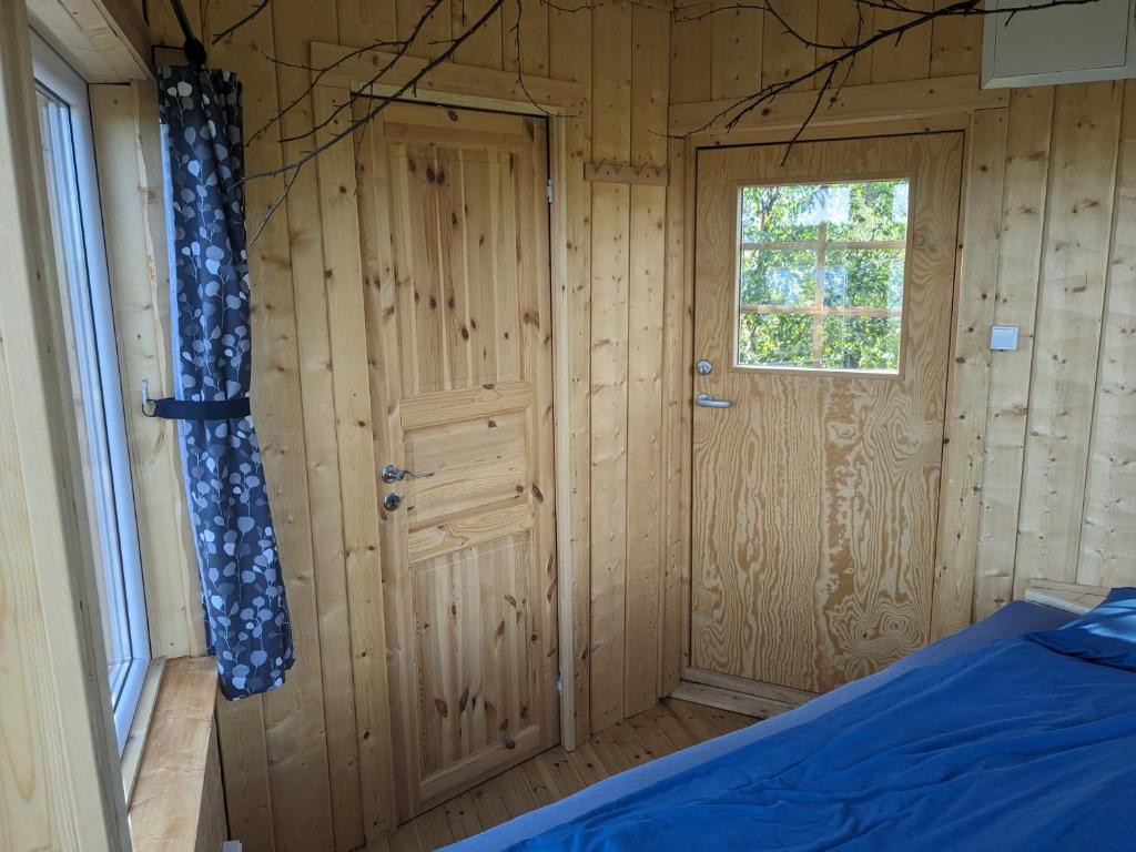 Postel nebo postele na pokoji v ubytování Aurora Lodge