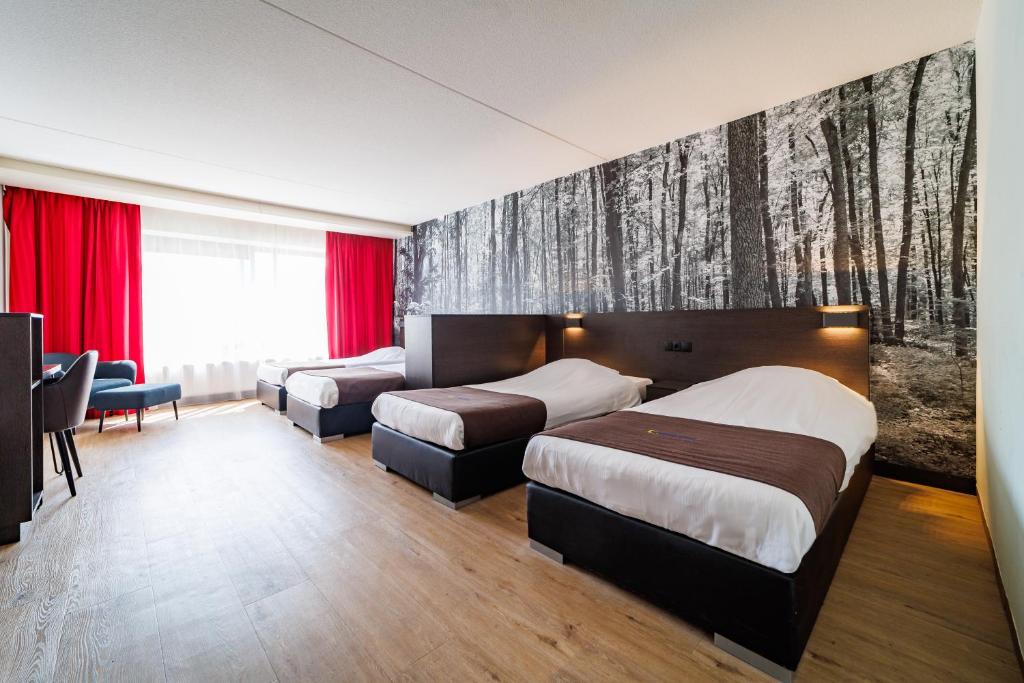 Postel nebo postele na pokoji v ubytování Bastion Hotel Arnhem