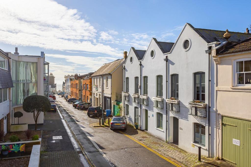 a city street with houses and cars on the street at Luxury 5 Bedroom House By The Sea in Brighton & Hove