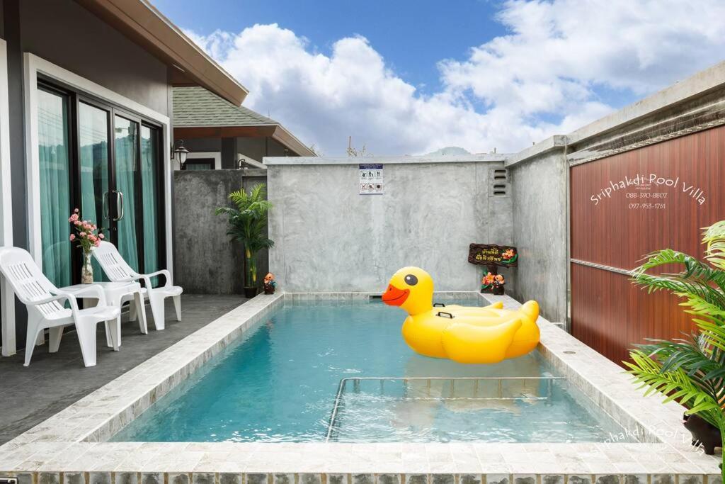 a rubber duck sitting in a swimming pool at Sriphakdi Pool Villa Aonang Krabi in Ao Nang 