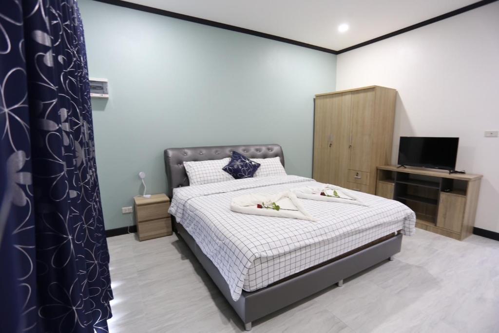 Postel nebo postele na pokoji v ubytování MB House Resort