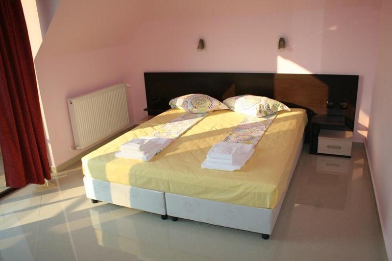 A bed or beds in a room at Silistar Hotel