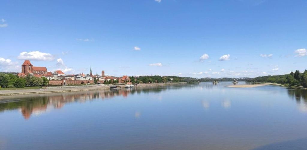 a view of a river with a city in the background at t45yhfg in Pobierowo
